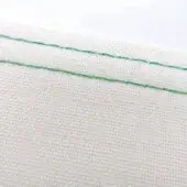 White fabric with diagonally stitched luminous green thread, displaying a tight woven texture and matte finish against a plain background.
