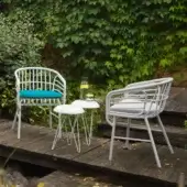Distinguished Casamania Raphia armchair with curved silhouette and plush gray cushioned seat in painted aluminum
