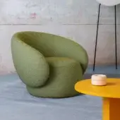 Distinctive Miniforms Nebulona lounge chair with plump curvaceous seat upholstered in striking green textile and drop-shaped armrests