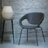 Sophisticated Casamania Vad armchair with dark gray matt polypropylene seat and sleek dark gray metal legs