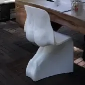 Distinctive Casamania Him & Her chair crafted in all-white rotationally mass-dyed molded polyethylene with organic sculpted form