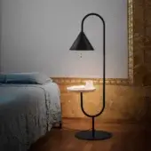 Distinguished Miniforms Ozz floor lamp with curved matte black metal and integrated light-colored wooden table
