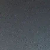 Matte graphite metal texture with fine granular detail, displaying a consistent muted gray tone and even diffused lighting across a flat surface.