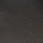 Dark gray leather texture with repeating geometric pattern of raised triangles and rhomboids, exhibiting a matte, quilted surface.