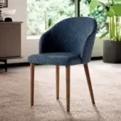 Sophisticated Ozzio Italia Zico armchair with enveloping padded seat in textured blue textile and smooth light brown wooden legs