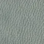 Gray nubuck leather texture with repeating diamond indentations in horizontal rows, exhibiting a matte finish and natural grain variations.