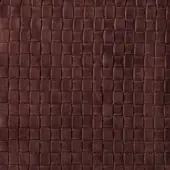 Brown leather texture with a quilted rectangular grid pattern, displaying natural grain and a matte, distressed finish.