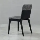 Distinguished Cierre1972 Marlon chair with textured gray textile upholstery and dark wooden legs offering a balanced aesthetic