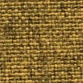 Jute fabric texture displaying a coarse, irregular weave in golden yellow, tan, and brown tones with a visible brand label.