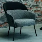 Elegant Bross Wam lounge chair upholstered in textured gray fabric with a contrasting black accent and sleek matte metal frame