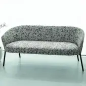 Distinguished Bross Wam sofa with curved silhouette and light gray patterned fabric upholstery supported by sleek black metal legs