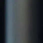Dark tonal gradient from bluish-gray to black, with a central bright light, smooth lacquered texture, studio backdrop.