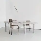 Elegant Cierre1972 Adele table with slim metal trim mirroring leather seams and glossy marbled finish