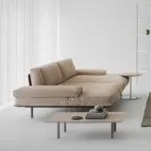 Harmonious Cierre1972 Vogue sofa with light beige textile and dark metal frame exhibits rationalist geometry