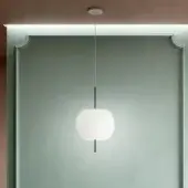 Elegant Kundalini Kushi suspension lamp with a mouth-blown opal glass diffuser and sleek black rods