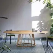 Distinguished Miniforms Acco table crafted in light-toned wood with an airy geometric base displaying a regular pattern