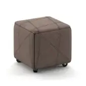 Grey quilted ottoman on black casters features a cube shape with textured fabric and crisscross stitching against a white backdrop.