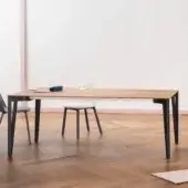Elegant Miniforms Decapo table with wood-like top and dark ‘V’ shaped legs crafted in Italy