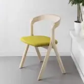 Architectural Miniforms Diverge chair with a light wood frame and vibrant yellow-green upholstered seat crafted in Italy