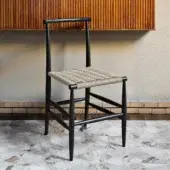 Superior Miniforms Pelleossa chair crafted in Italy with a matte black wooden frame and light beige checkered weave seat