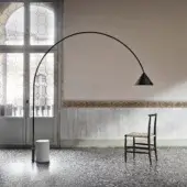 Elegant Miniforms Ozz floor lamp with a sweeping matte black metal arc crafted in Italy