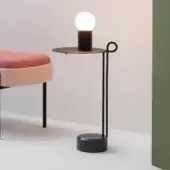 Distinguished Bross Loop coffee table with looping matte black steel and Black Marquina marble base for a contemporary aesthetic