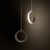 Sophisticated Ozzio Italia Sole suspension lamp with two rings exhibiting a visible wood grain pattern and warm bright light