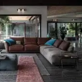 Harmonious Cierre1972 Clift sectional with brown leather-like material and gray textile upholstery, soft backrests and outward bent armrests