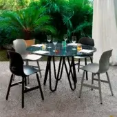 Distinguished Casamania Meduse table with smoked glass top and interwoven black painted metal base crafted in Italy