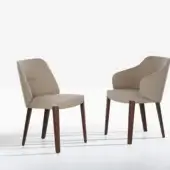 Exceptional Potocco Concha armchair with enveloping form upholstered in light beige textile and oak legs with dark finish