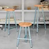 Remarkable Miniforms Milk stool with light-toned wood and glossy light blue metal legs crafted in Italy
