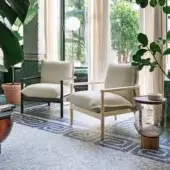 Exceptional Miniforms Sergia lounge chair with light-toned wood and thick, textured cushion offering a clean aesthetic
