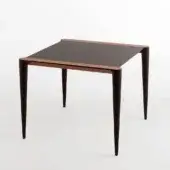 Distinguished Horm Bolero Bistrot table with dark matte tabletop and Canaletto walnut detailing crafted in Italy