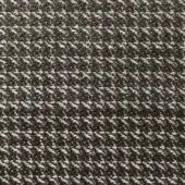 Herringbone fabric texture in dark charcoal gray and off-white, featuring a dense, diagonal weave with a matte finish.