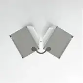 Wall-mounted 60° light fixture, gray aluminum, V-shaped design with white slats and a curved bottom element against a white wall.