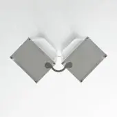 Wall-mounted light fixture, gray metal, geometric design with two rectangular boxes connected by a curved arm and vertical ribbed slats.