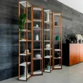 Distinguished Horm Singles bookcase crafted with walnut structure and fixed lacquered MDF shelves in a warm brown finish