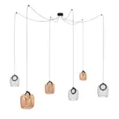 Chandelier with six amber glass pendants, rounded shapes, black wires, and white canopy, staggered arrangement, minimalist design.