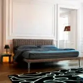Exceptional Horm Ebridi bed with brown textile upholstery, button-tufted headboard and mocha lacquered beechwood feet