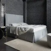 Distinguished Horm Sardegna bed with light gray textile upholstery and concealed beechwood feet offers contemporary style