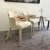 Distinguished Casa Casati Lola Royale chair crafted with beech wood and off-white leather, upholstered in patterned fabric with red, yellow, grey tones and a matte finish