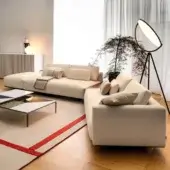 Distinguished Horm Ragtime sectional sofa with light beige textile upholstery and a matte finish resting on a dark base