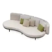 Boucle sofa, off-white, curved asymmetrical form with black trim and rectangular cushions, accented by green, beige, and taupe textured pillows.