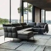 Distinctive Cierre1972 Simply sectional with dark gray quilted upholstery, elegant piping and slender metal legs
