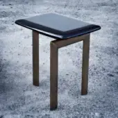 Elegant Casa Casati Sasso side table with glossy black lacquered wood and bronze-like metal supporting structure