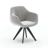Delia accent chair, light gray velvet, rounded form with angled armrests and black angled wooden legs.