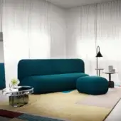 Exclusive Miniforms Botera sofa, a modular seating system upholstered in dark teal textured textile with curved silhouette