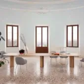 Graceful Miniforms Plauto Maxxxi conference table with light-toned wood and substantial rectangular legs in a smooth matte finish