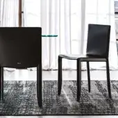 Sophisticated Cattelan Italia Piuma Edition chair in sleek dark leather with a uniform finish exemplifies modern comfort