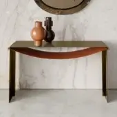 Superior Bontempi Piper console with slender metal structure and saddle-leather element beneath gold finish